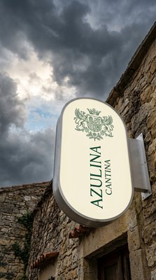 Illuminated Signage of Azulina Cantina Against Dramatic Sky