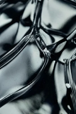 Close-up of Smooth Black Surface with Reflections