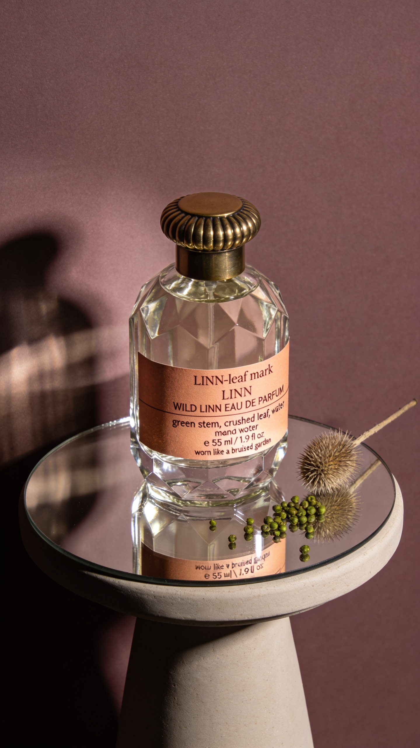 Elegant Glass Perfume Bottle on a Reflective Surface