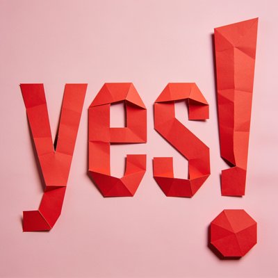 Colorful Origami 'Yes!' Art on Pink Background