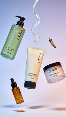 CATKIN Hair Care Products Showcase with Vibrant Background